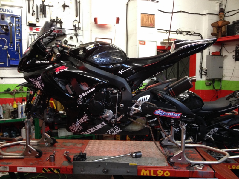 Image of race bike ready for new tyres